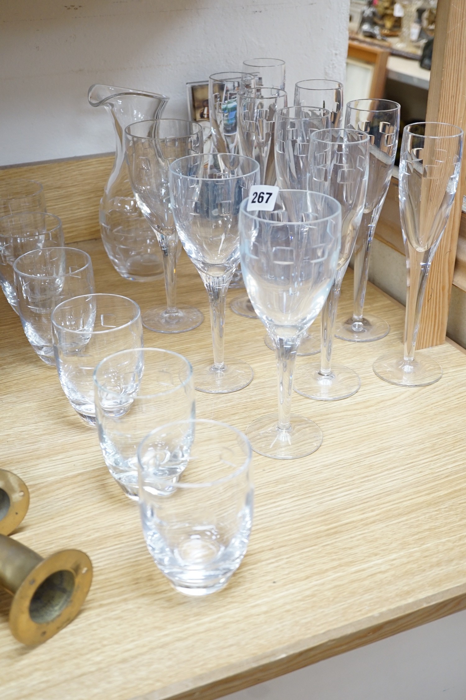 John Rocha for Waterford. A set of 8 cut glass flutes with six matching tumblers, three goblets and a carafe